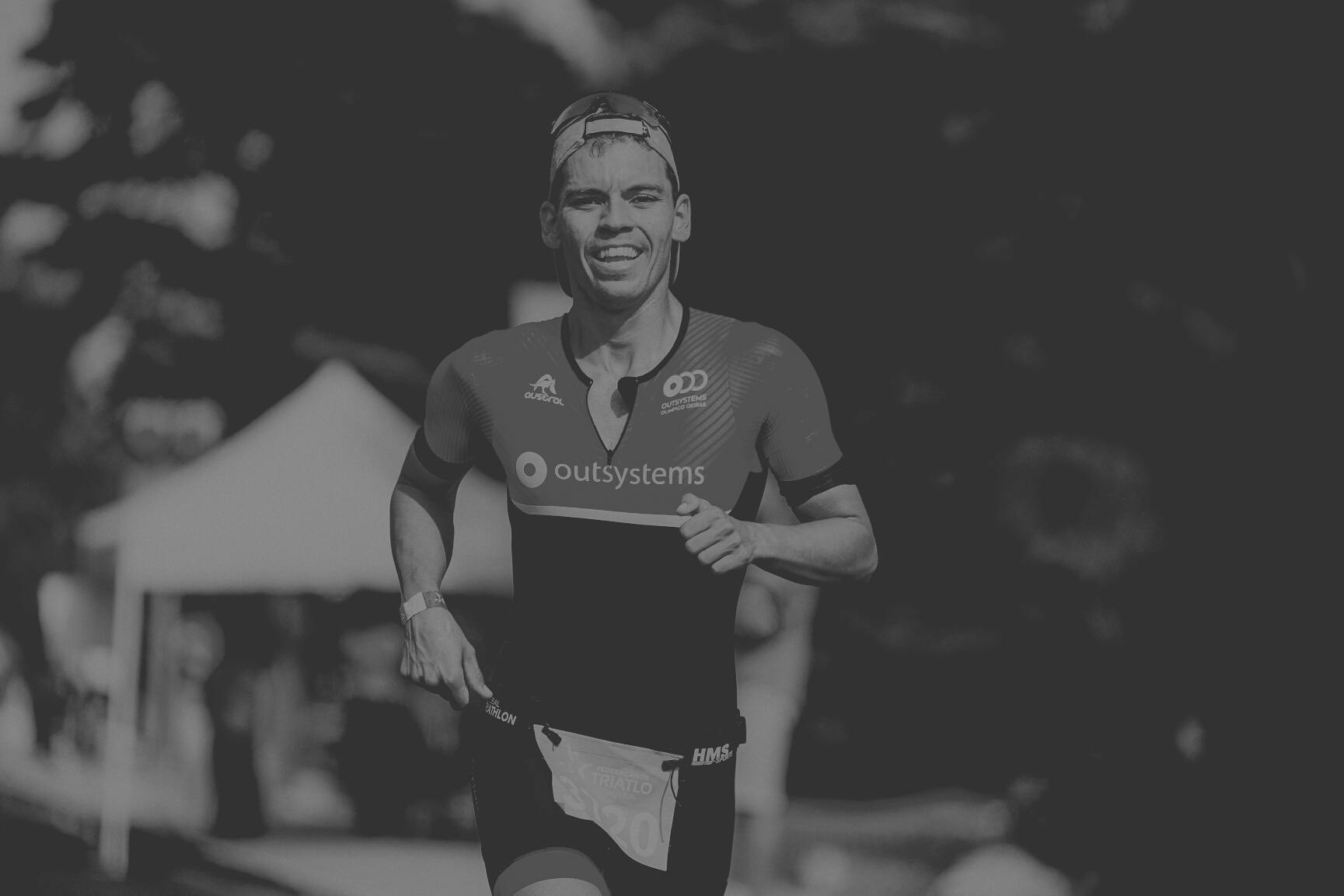 Young happy sportsman running marathon fast